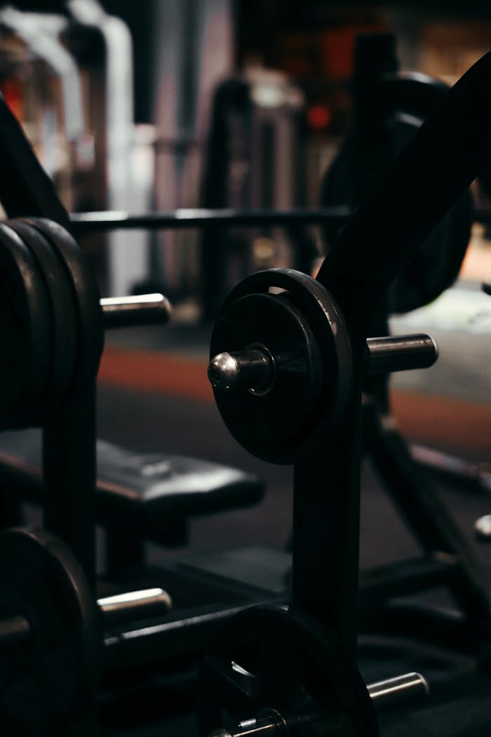 An up-close view of weightlifting equipment in a modern gym setting, perfect for fitness enthusiasts.